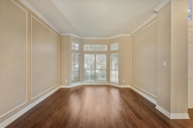 spare room with dark wood-type flooring and ornamental molding