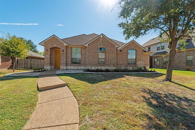 view of front of property with a front lawn