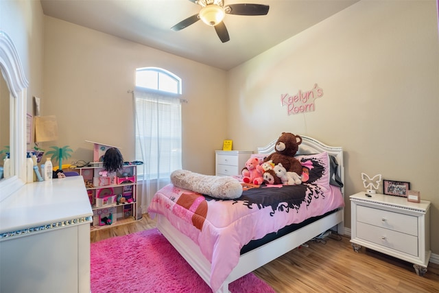 bedroom featuring light wood-type flooring and ceiling fan