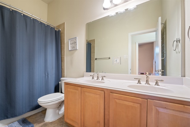 bathroom with vanity, curtained shower, toilet, and tile patterned floors