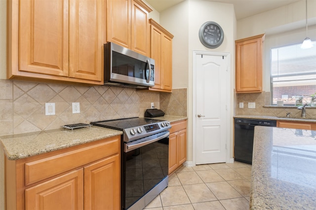 kitchen with appliances with stainless steel finishes, light tile patterned flooring, decorative backsplash, and hanging light fixtures