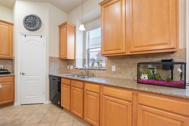 kitchen featuring decorative backsplash, black dishwasher, light tile patterned floors, pendant lighting, and sink