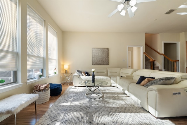 living room featuring ceiling fan and wood-type flooring