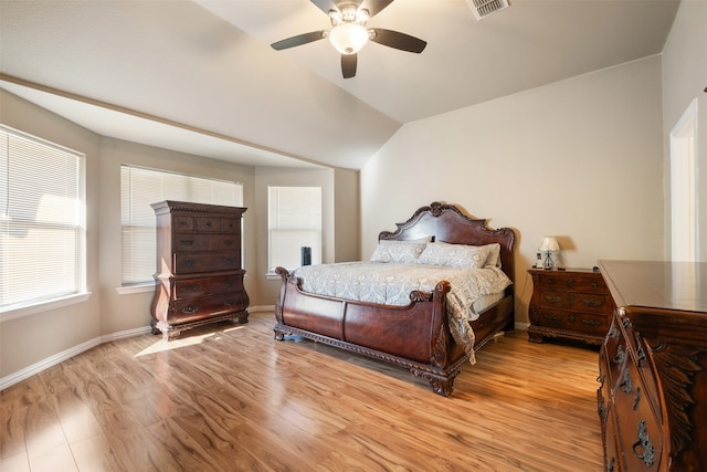 bedroom featuring lofted ceiling, light wood-type flooring, and ceiling fan