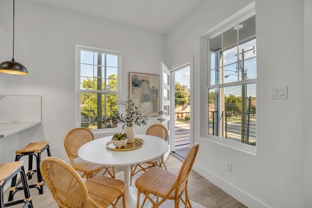 dining space featuring light hardwood / wood-style floors and a wealth of natural light