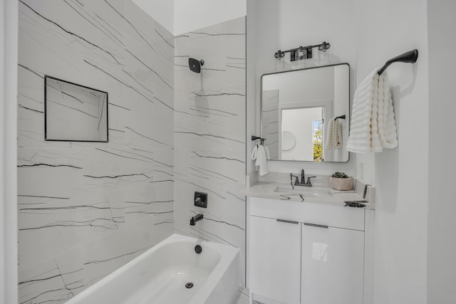 bathroom featuring vanity and tiled shower / bath