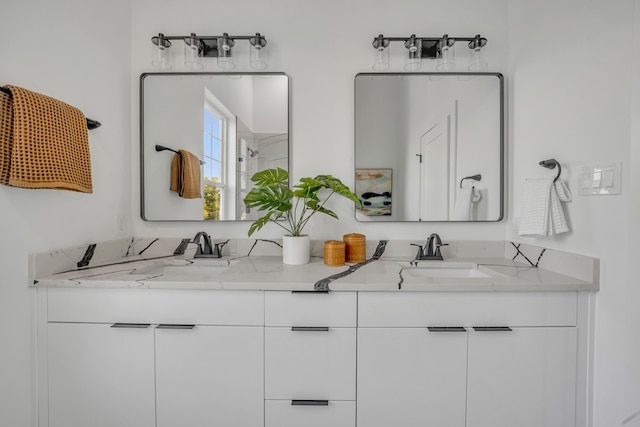 bathroom featuring vanity and a shower