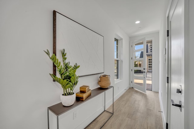 hall with light hardwood / wood-style flooring