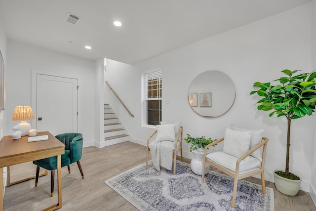 sitting room featuring light hardwood / wood-style floors