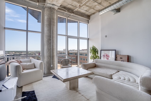 living room with a towering ceiling and a wealth of natural light