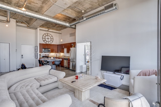 living room with a high ceiling