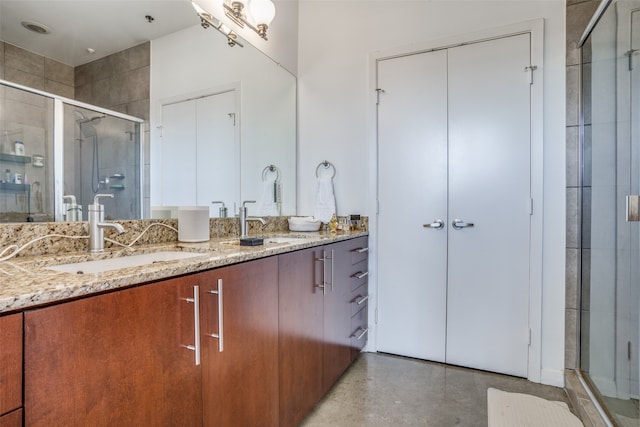 bathroom featuring vanity, concrete floors, and an enclosed shower