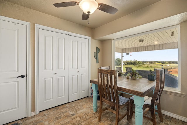 dining space featuring ceiling fan