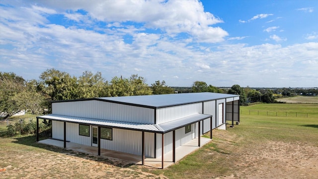 2720 N US-377, Stephenville, TX 76401 - view of home's exterior with an outdoor structure, an outbuilding, a yard, and metal roof
