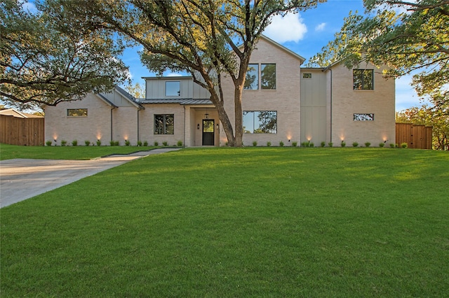 4208 Allencrest, Dallas, TX 75244 - view of front of property with a front lawn, fence, metal roof, and a standing seam roof