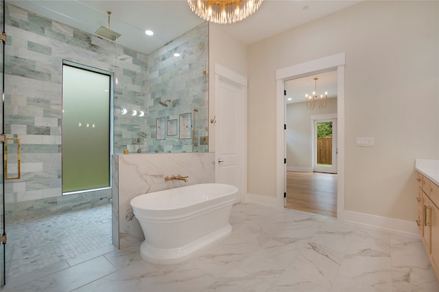 bathroom featuring vanity, a notable chandelier, independent shower and bath, and tile walls