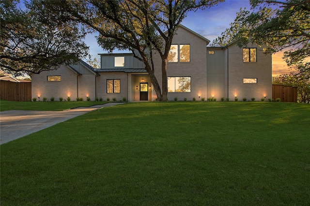 4208 Allencrest, Dallas, TX 75244 - view of front facade featuring a lawn, fence, and a standing seam roof
