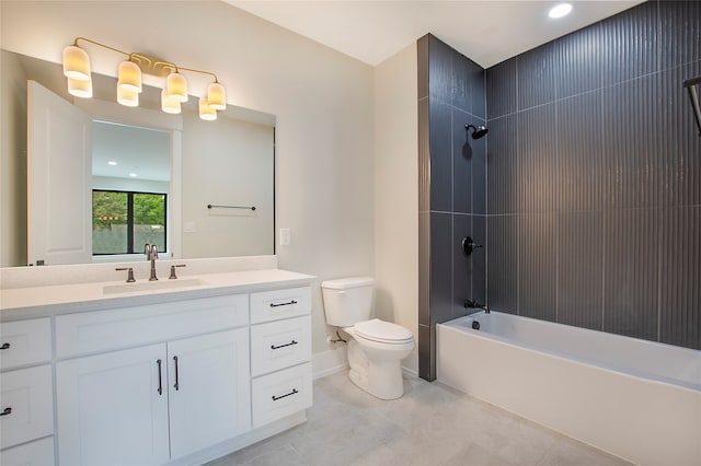 full bathroom with tiled shower / bath, vanity, and toilet