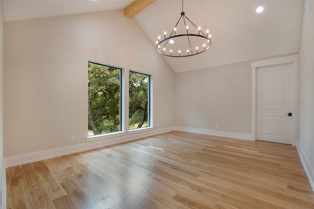 unfurnished room featuring beam ceiling, high vaulted ceiling, a chandelier, and light wood-type flooring