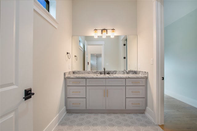 bathroom with vanity and hardwood / wood-style floors