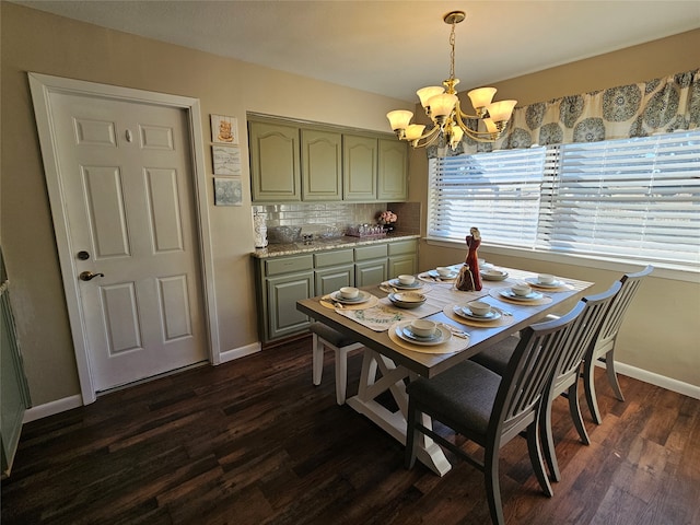 dining area featuring an inviting chandelier and dark hardwood / wood-style flooring