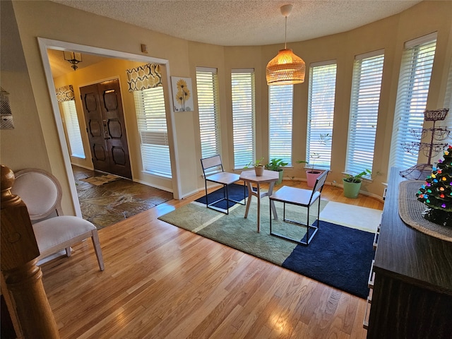 dining area with hardwood / wood-style flooring and plenty of natural light