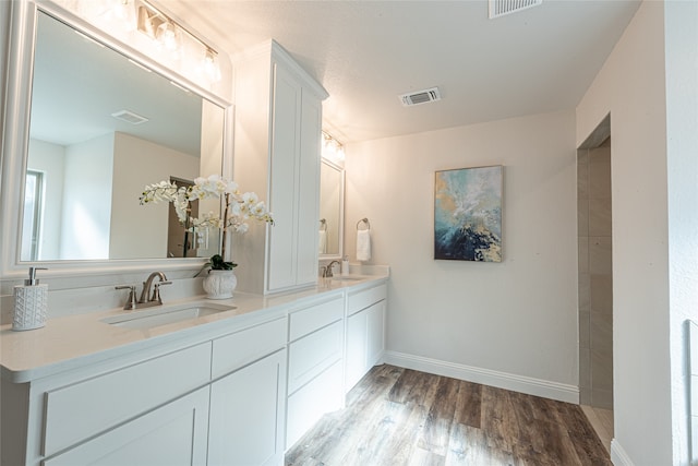 bathroom featuring vanity and hardwood / wood-style flooring