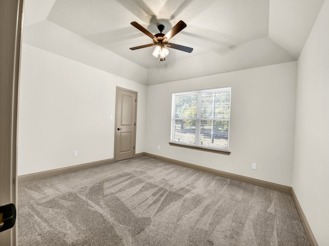 spare room with ceiling fan, carpet flooring, and lofted ceiling