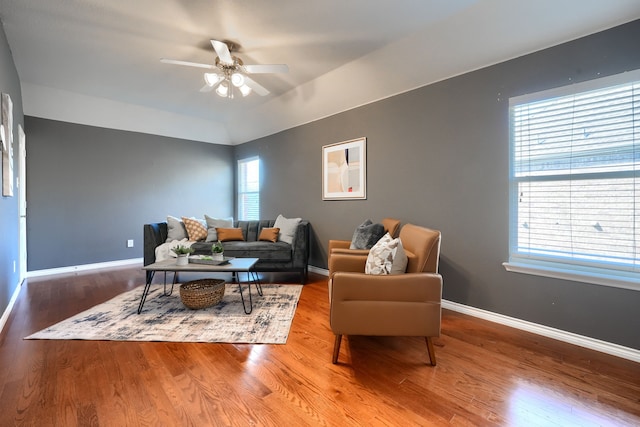 living room featuring lofted ceiling, ceiling fan, hardwood / wood-style flooring, and plenty of natural light