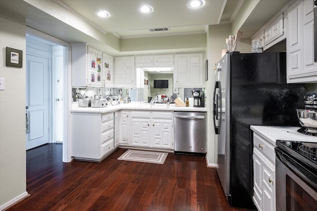 kitchen featuring decorative backsplash, dark hardwood / wood-style floors, stainless steel appliances, ornamental molding, and white cabinets