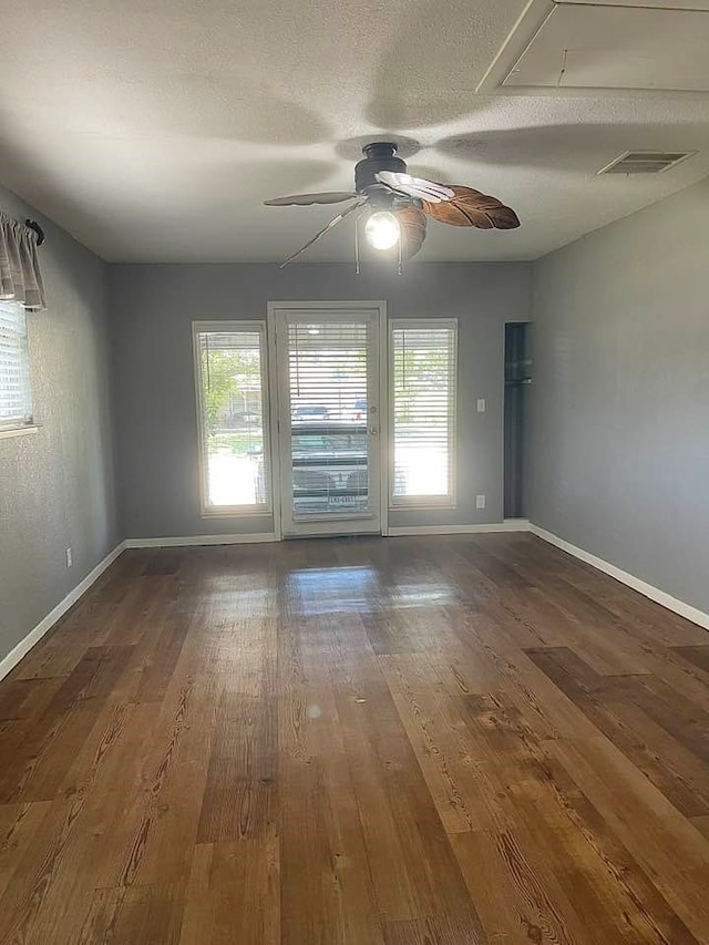 unfurnished room featuring ceiling fan, a textured ceiling, and hardwood / wood-style floors