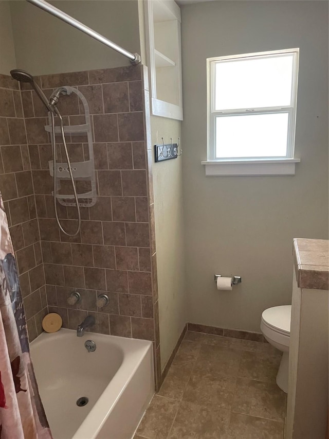 bathroom featuring shower / tub combo and toilet