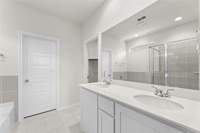 bathroom featuring tile patterned flooring, vanity, and independent shower and bath