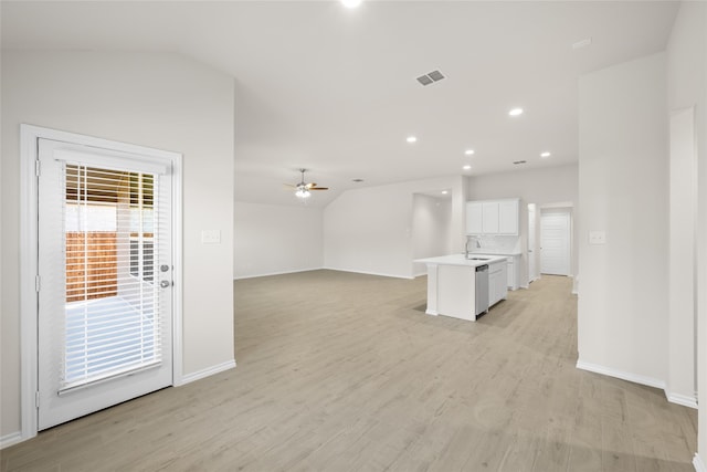 unfurnished living room featuring light hardwood / wood-style floors, ceiling fan, lofted ceiling, and sink