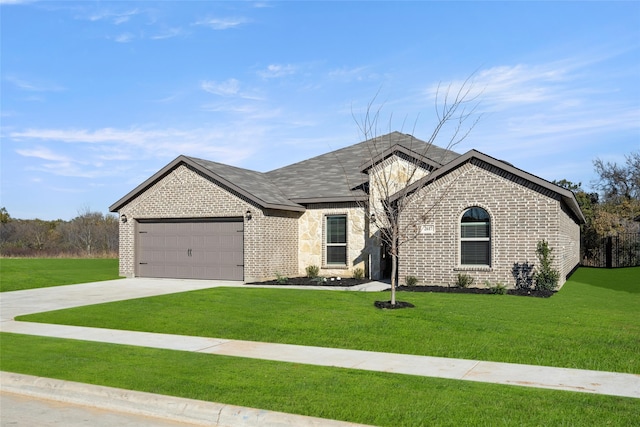 view of front of home with a garage and a front yard