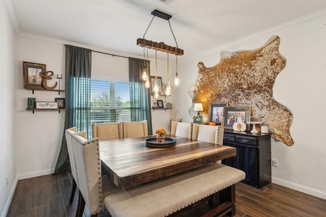 dining area featuring crown molding