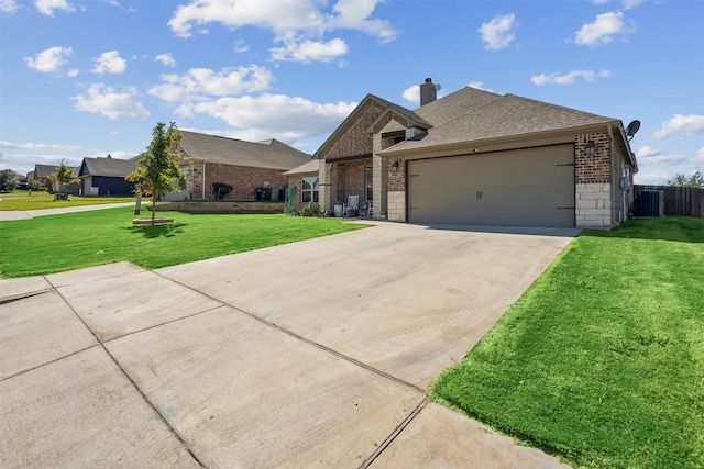 view of front facade with a garage and a front yard