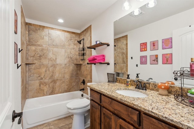 full bathroom featuring toilet, tile patterned flooring, tiled shower / bath combo, and vanity