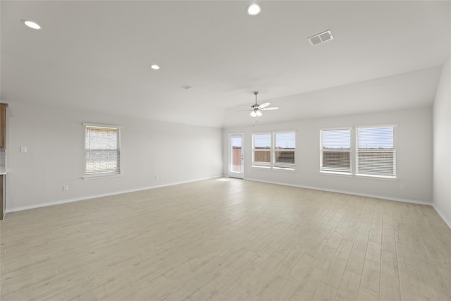 empty room with ceiling fan and light wood-type flooring