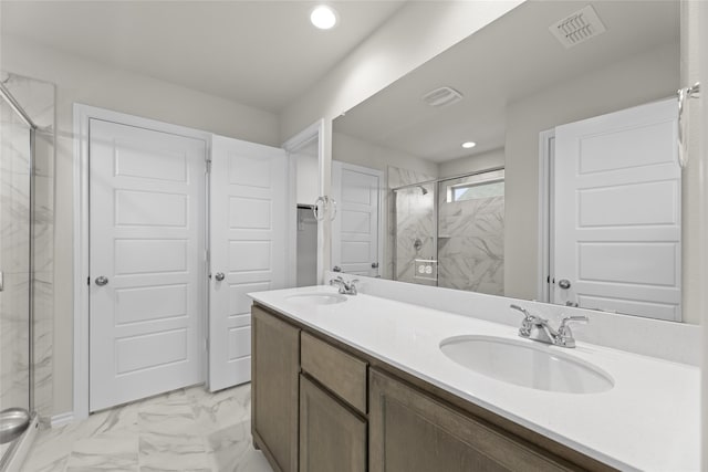 bathroom with vanity and an enclosed shower