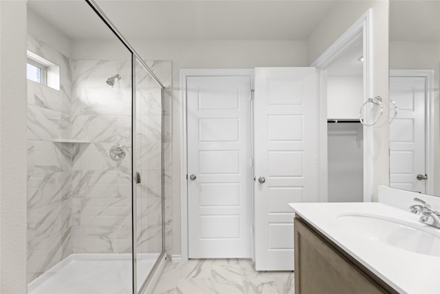 bathroom featuring vanity and an enclosed shower