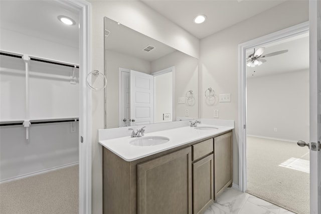 bathroom featuring ceiling fan and vanity