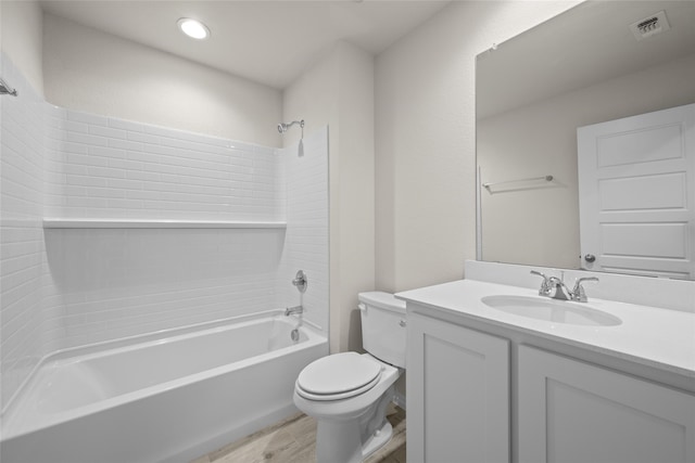 full bathroom featuring shower / tub combination, vanity, toilet, and hardwood / wood-style floors