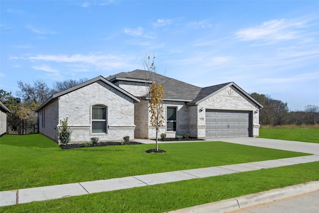 view of front facade featuring a garage and a front lawn