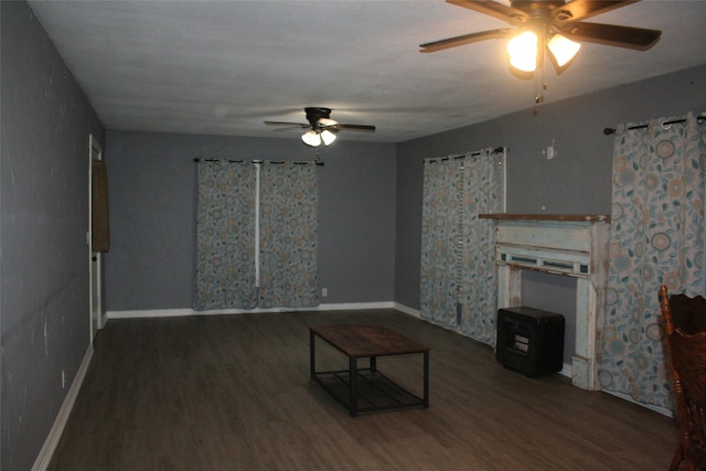 unfurnished living room with dark wood-type flooring and ceiling fan