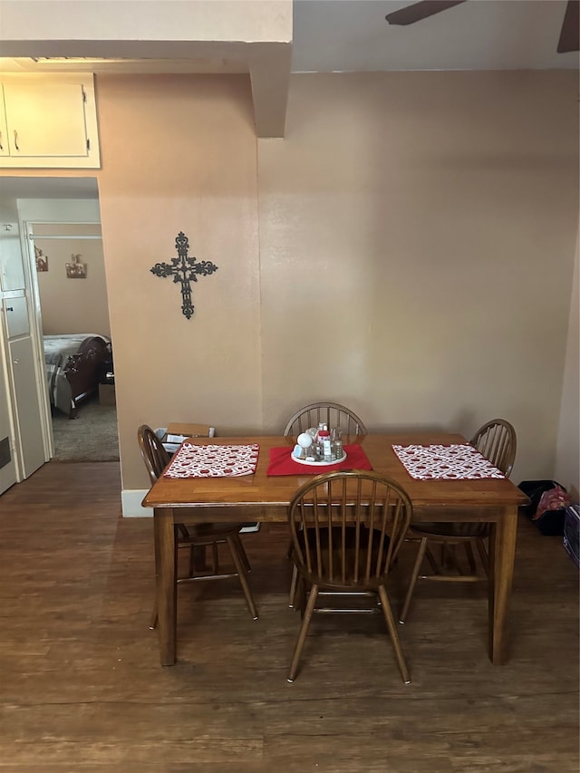 dining room featuring ceiling fan and dark hardwood / wood-style flooring