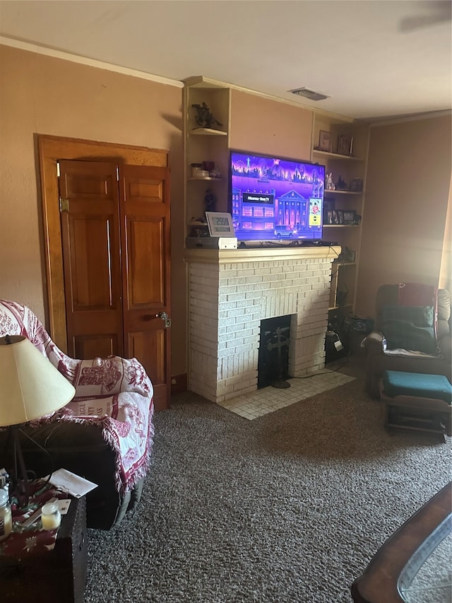 living room featuring ornamental molding, carpet flooring, and a fireplace