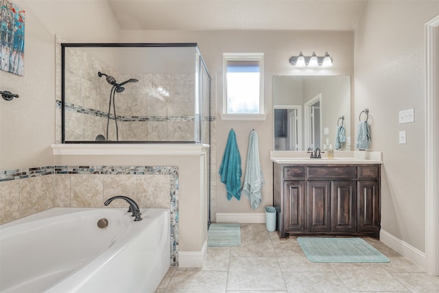 bathroom featuring tile patterned floors, vanity, and separate shower and tub