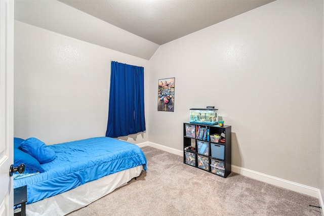 carpeted bedroom featuring vaulted ceiling