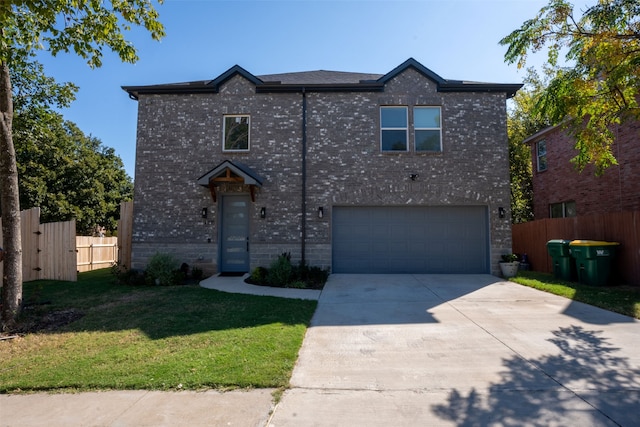 front facade featuring a front yard and a garage